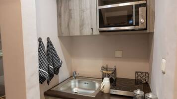 Fridge, coffee/tea maker, cookware/dishes/utensils