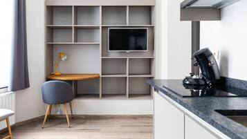 Premium Studio Suite | Living area | 32-inch Smart TV with satellite channels, TV