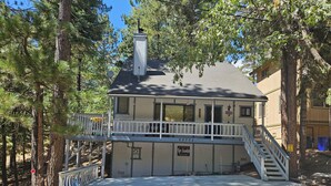 A two-story building with a balcony and a staircase leading to the upper floor. - Somethings old, somethings new, clean and cozy just for you. (ArrowBear)
