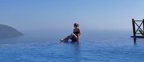 Seasonal outdoor pool, pool umbrellas, pool loungers