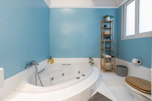 Bathtub, hair dryer, towels, soap