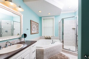 Bathtub, hair dryer, towels, soap