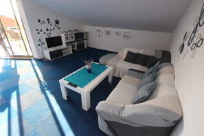 Apartment, 2 Bedrooms, Balcony | Living room | TV
