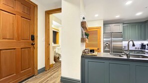 A modern kitchen with a built-in island, stainless steel appliances, and wooden cabinetry.