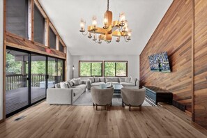 The sitting area features cozy furniture, a TV,... - Canyons Village Retreat•Stunning Mtn Views•Community Pools, Hot Tubs, and More (Park City)