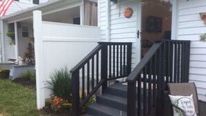 A house with a white exterior, black front steps, and a small porch area. - Lovely, clean and walkable in the town of Luray.  (Luray)