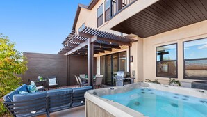 A backyard with a hot tub, patio furniture, and a pergola. - Ocotillo Springs Resort 69: 3bd, 3.5 bath with a Private Hot Tub, Fire Pit, and Private Patio (Santa Clara)