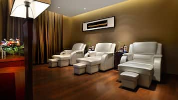 Relax in comfort with plush leather chairs and a warm, inviting atmosphere.