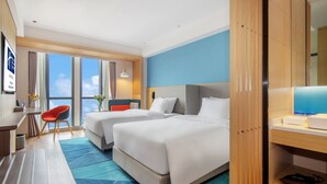 A hotel room with two beds, a desk, a chair, and a large window offering a view. - Holiday Inn Express Changsha Shengfu by IHG (Changsha)