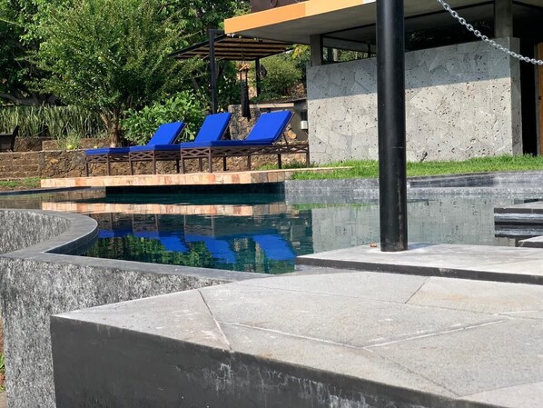 Outdoor pool, open 8:00 AM to 8:00 PM, pool umbrellas, pool loungers