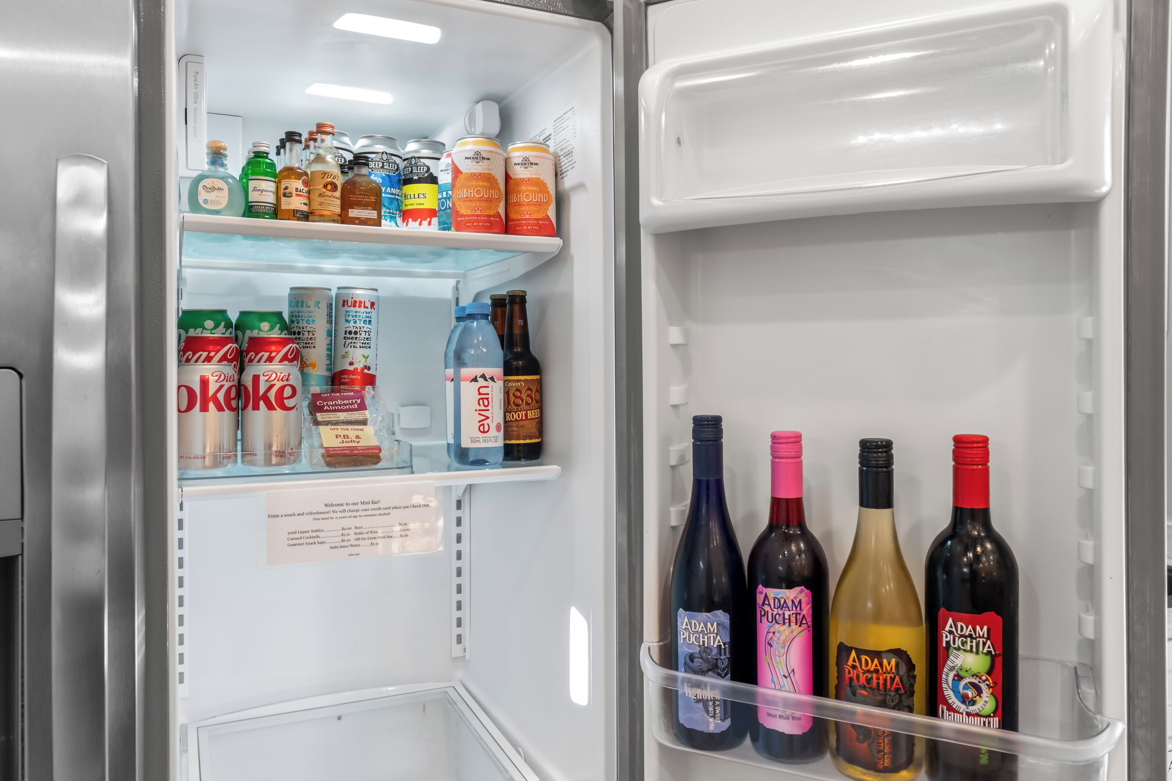 A refrigerator stocked with various beverages including bottles and cans.