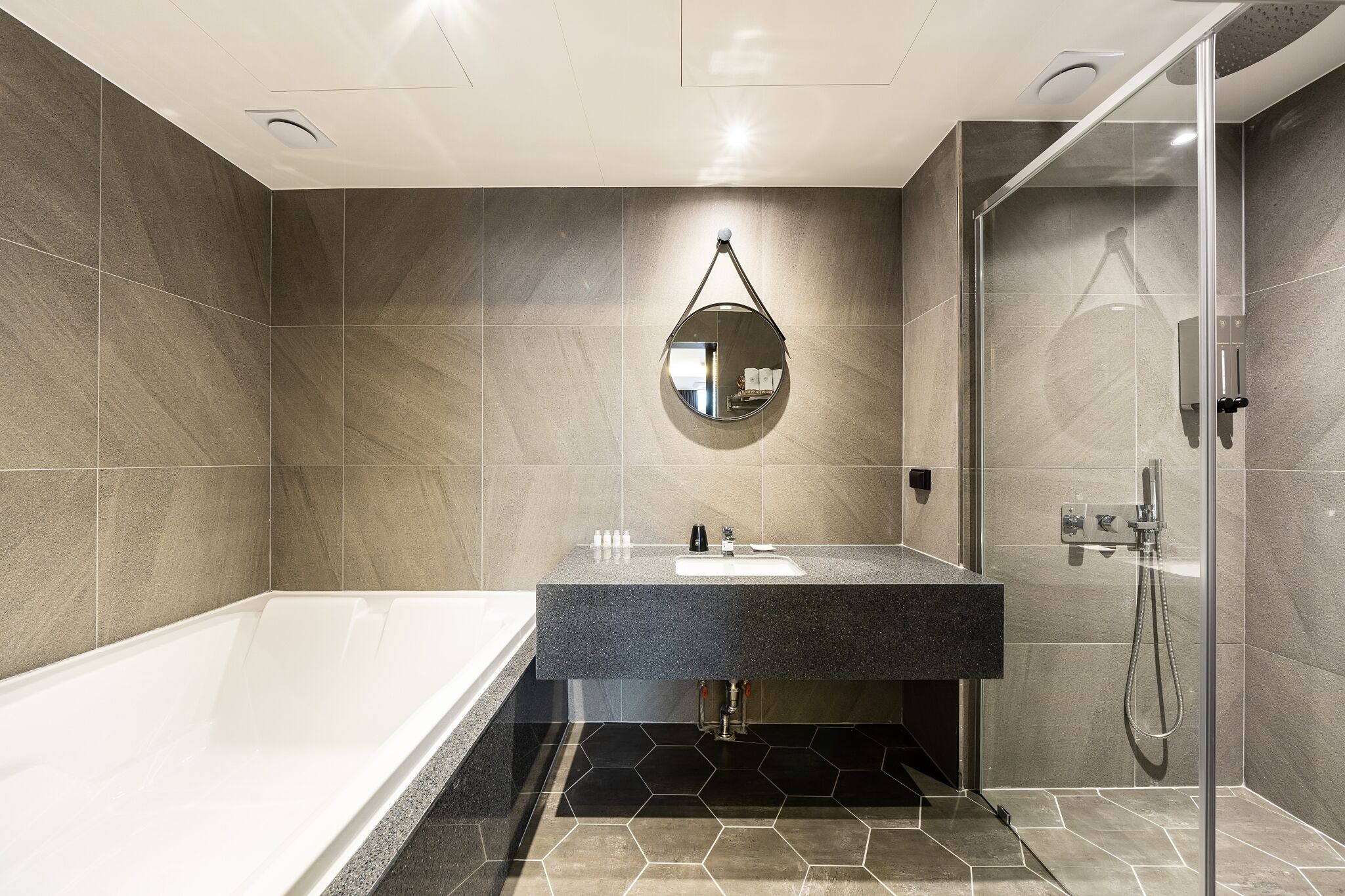 Separate bathtub and shower, hair dryer, bathrobes, slippers
