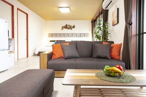 SAKURA | Living room | Flat-screen TV - Jin Jin House (Nakijin)