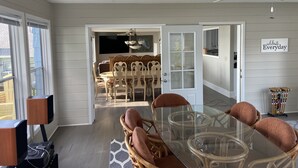 A dining area with a glass table and wicker chairs, a ceiling fan, and a 'celebrate Everyday' sign on the wall. - View are amazing that is what our guests say
5 Minutes to the Freeway and town (Rush City)