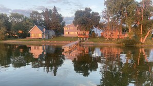 A lakeside residential area with houses, a dock, and a calm water body reflecting the surroundings. - View are amazing that is what our guests say
5 Minutes to the Freeway and town (Rush City)
