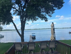A deck with chairs and an umbrella overlooking a lake with boats and a distant shoreline. - View are amazing that is what our guests say
5 Minutes to the Freeway and town (Rush City)