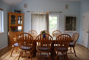 Enjoy meals in this dining room with a wooden table and six comfortable chairs.