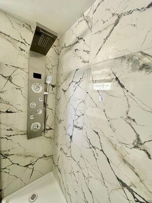 Shower, hair dryer, towels, soap