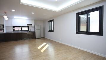 Flat-screen TV, DVD player, smart speakers