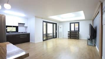 Flat-screen TV, DVD player, smart speakers