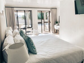 Habitación familiar | Sábanas de algodón egipcio, ropa de cama de alta calidad y minibar 