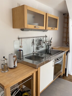 Enjoy cooking in this well-equipped kitchen with a stainless steel sink, double oven, and ample storage.