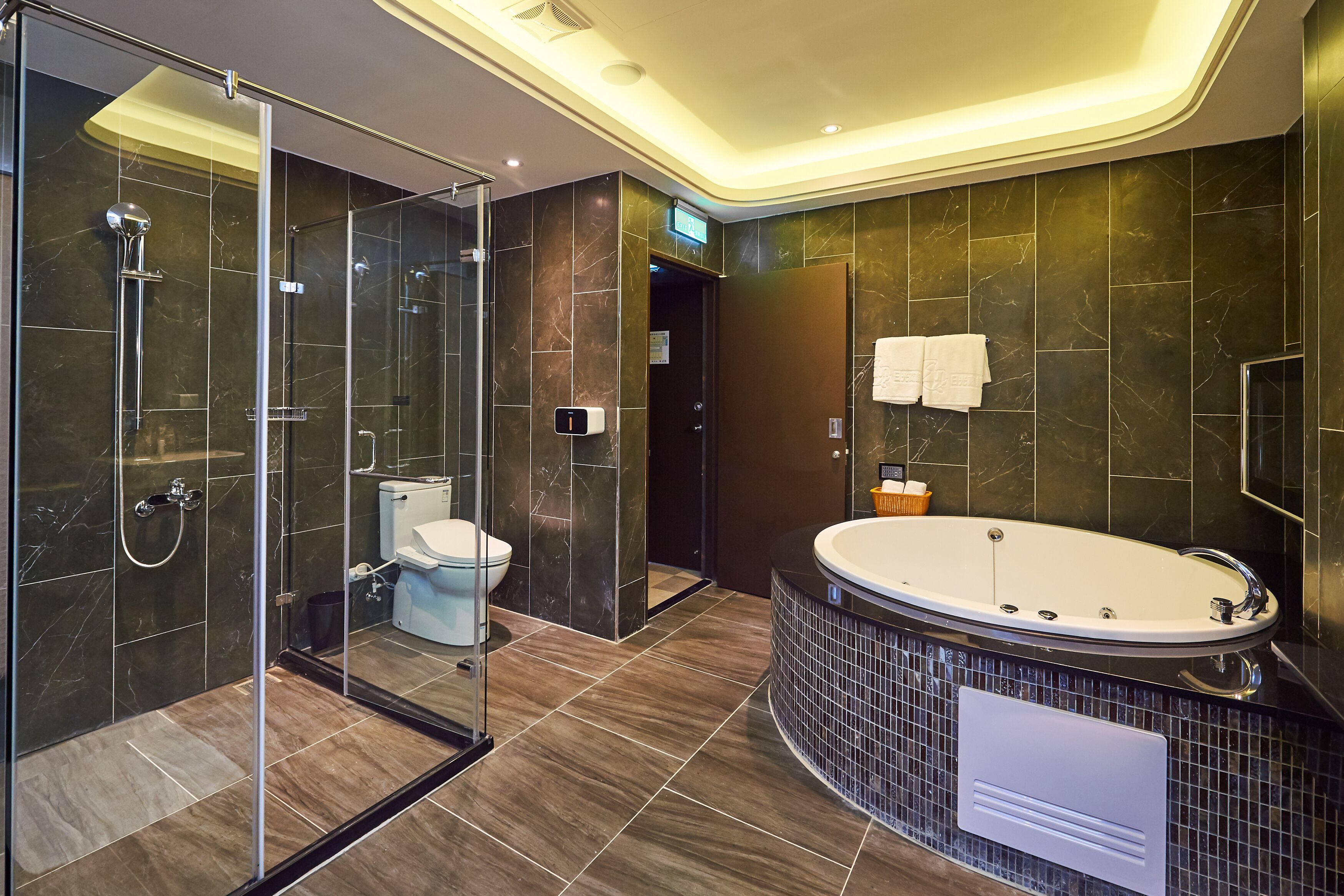 garage room(check in time 8pm) | bathroom | jetted bath, rainfall showerhead, free toiletries, hair dryer