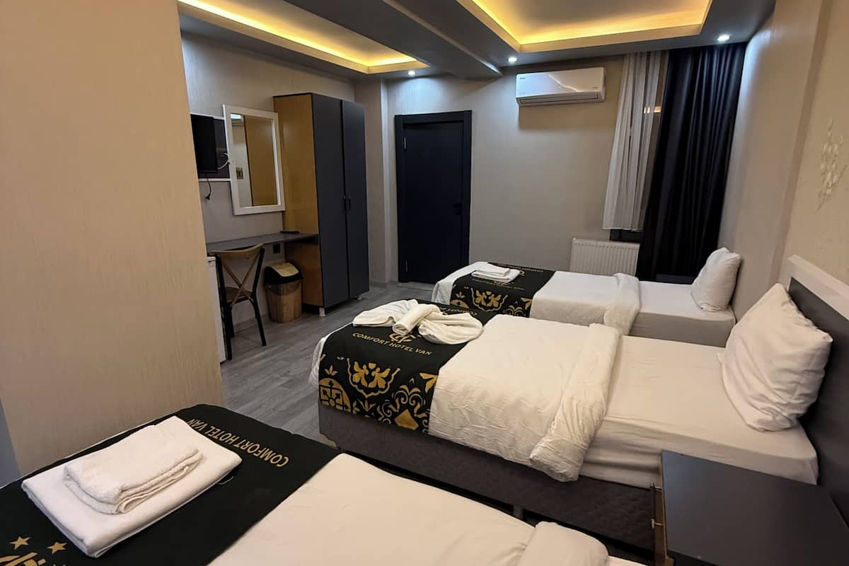 Triple Room | Minibar, desk, laptop workspace, blackout curtains
