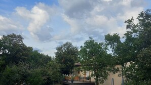 A swimming pool with a ladder, surrounded by trees and a house in the background. - Detached villa, Swimming pool, Spa, Garden furniture. Near Vallon Pont d'Arc. (Labastide-de-Virac)