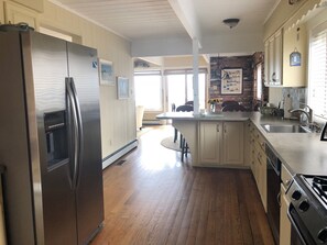 Microwave, dishwasher, coffee/tea maker, cookware/dishes/utensils