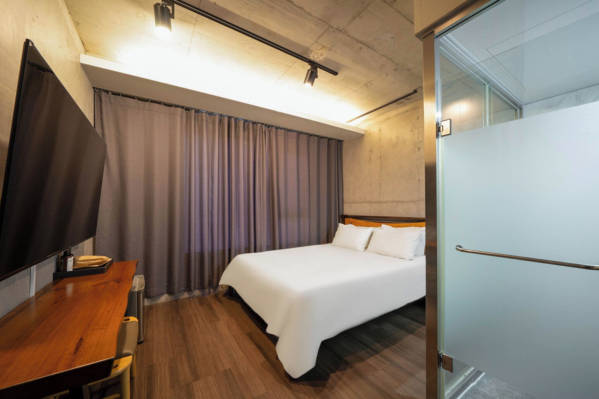 Premium bedding, down comforters, blackout drapes, soundproofing