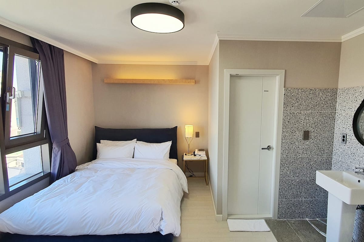Premium bedding, down comforters, blackout drapes, soundproofing