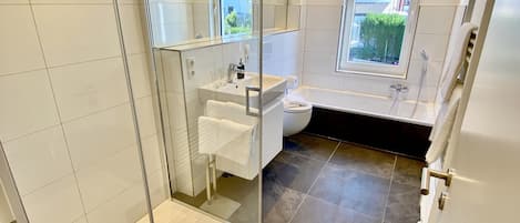 Bathtub, hair dryer, towels, soap