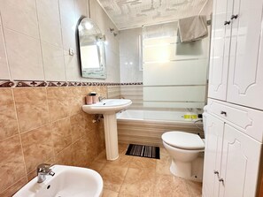 Hair dryer, bidet, towels, soap