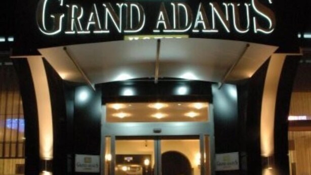 The entrance to Grand Adanus hotel with a prominent illuminated sign. - Grand Adanus Hotel (Adana)