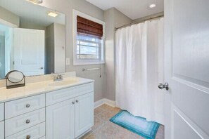 Combined shower/tub, hair dryer, towels, soap