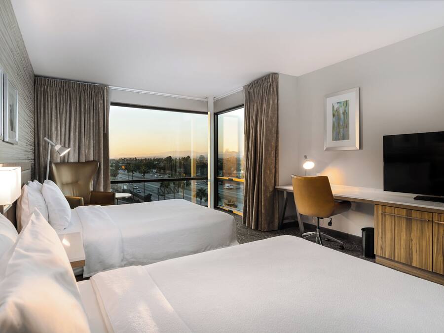 Room, 2 Queen Beds, Corner | In-room safe, desk, blackout drapes, iron/ironing board