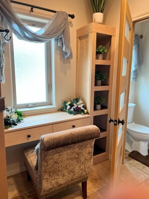 Bathtub, hair dryer, towels, shampoo