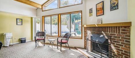 Sit next to the Electric Fireplace in our Pool Lounge