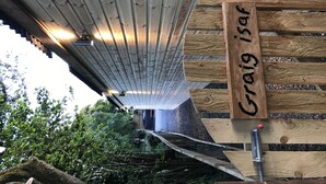 A wooden sign with the name "Craig Isar" mounted on a wall. - Countryside Home with jacuzzi hot tub, open plan living and wood burner. (Ruthin)