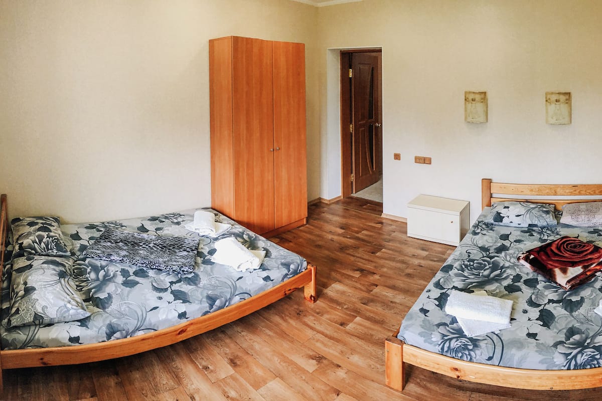Elite Cabin | Premium bedding, memory foam beds, laptop workspace, blackout drapes