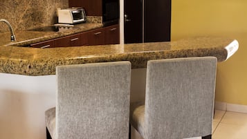 Fridge, microwave, stovetop, coffee/tea maker