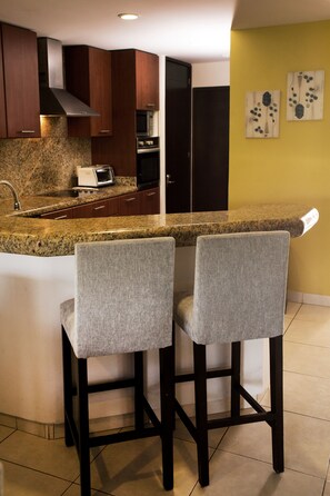 Fridge, microwave, stovetop, coffee/tea maker
