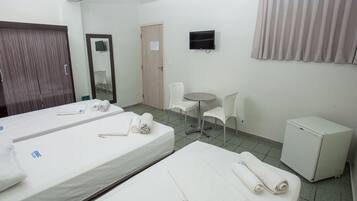 Minibar, desk, bed sheets