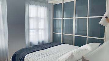 2 bedrooms, desk, iron/ironing board, travel crib