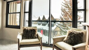 A room with two chairs and a large window. - Managed by Park City Lodging-Luxury 2 Bdrm Ski-In/Ski-Out at Park City Mountain (Park City)
