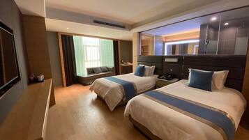 Deluxe Suite (With View) | Minibar, desk, blackout curtains, rollaway beds