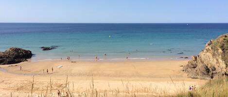 On the beach, sun loungers, beach towels