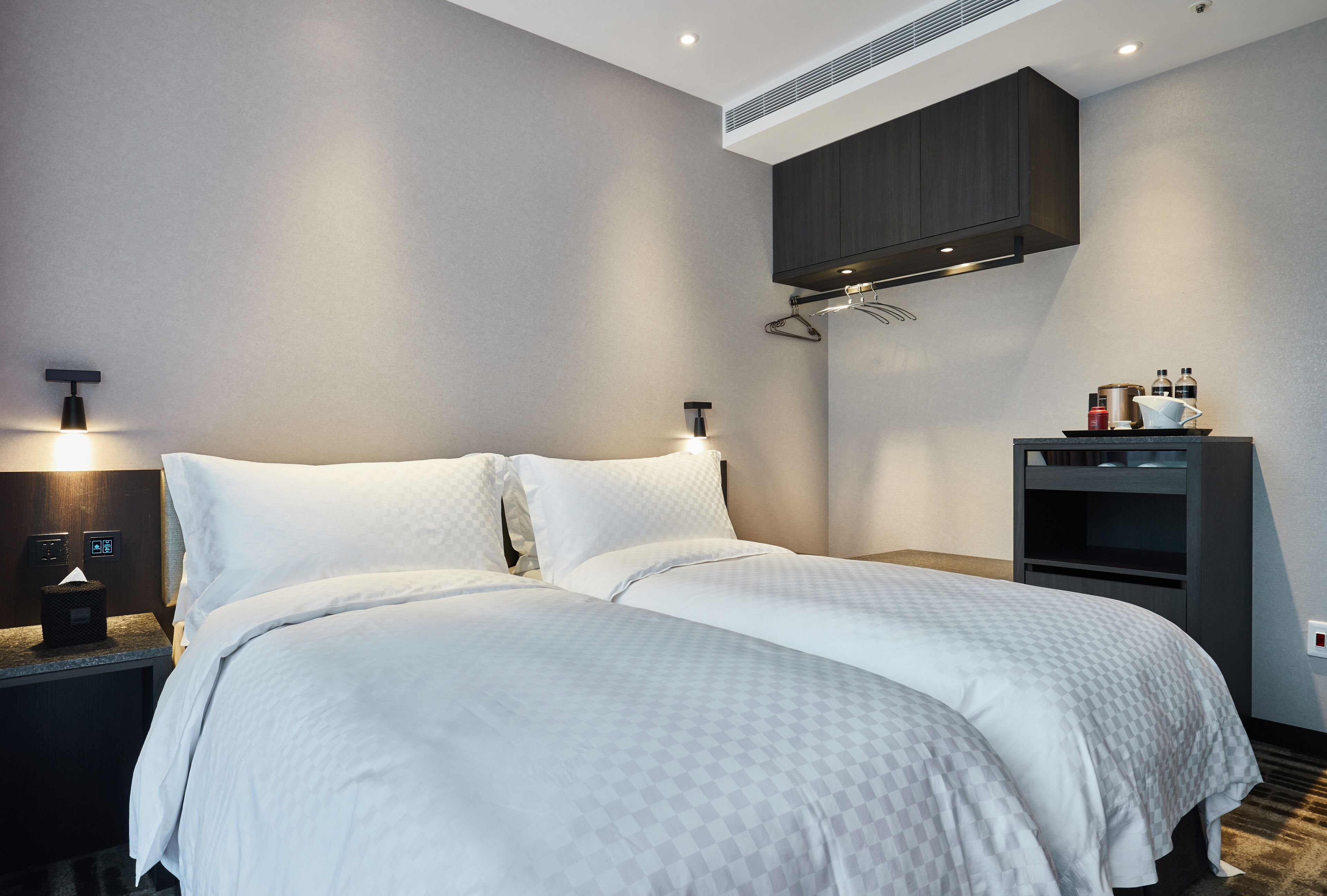 sky studio, two twin beds | minibar, in-room safe, desk, blackout curtains