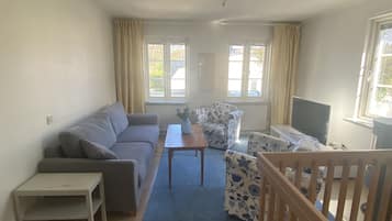 Deluxe Villa | Living room | Flat-screen TV, fireplace